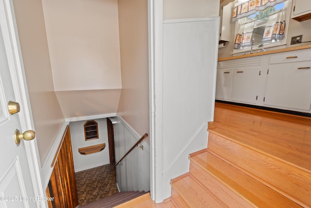 8703 Fernview Dr, Louisville, KY 40291 - stairs featuring wood finished floors