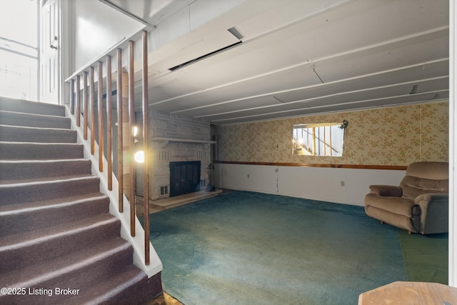 8703 Fernview Dr, Louisville, KY 40291 - below grade area featuring wallpapered walls, a wainscoted wall, carpet flooring, a stone fireplace, and stairway