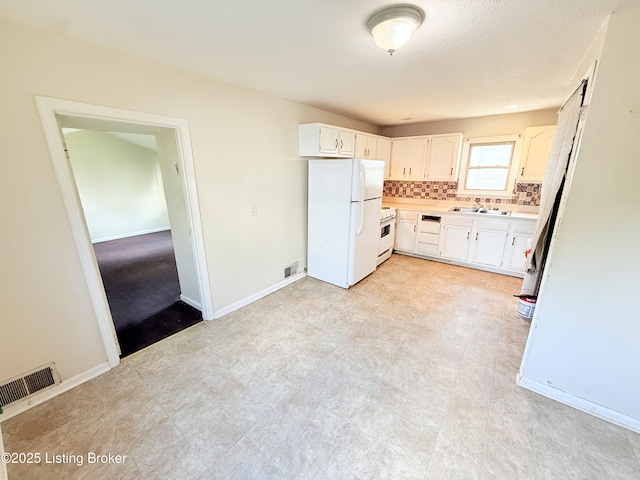 5123 Reed Ave, Louisville, KY 40214 - kitchen with white appliances, white cabinetry, light countertops, and decorative backsplash
