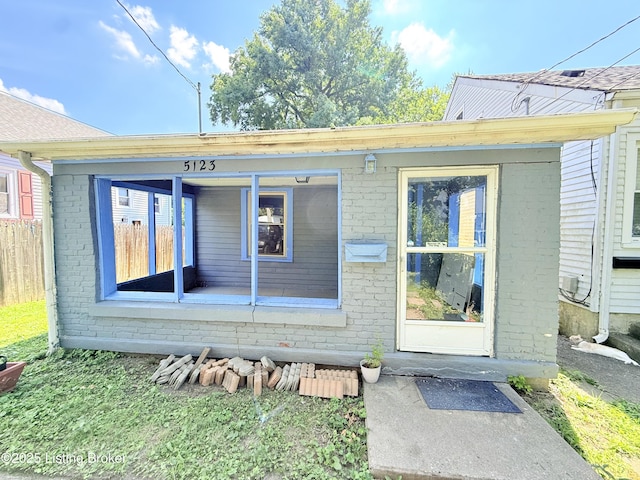 5123 Reed Ave, Louisville, KY 40214 - doorway to property with brick siding