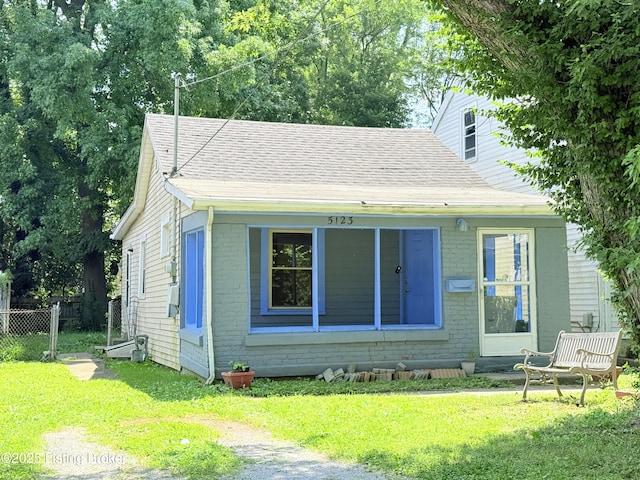 5123 Reed Ave, Louisville, KY 40214 - back of house with a shingled roof and brick siding