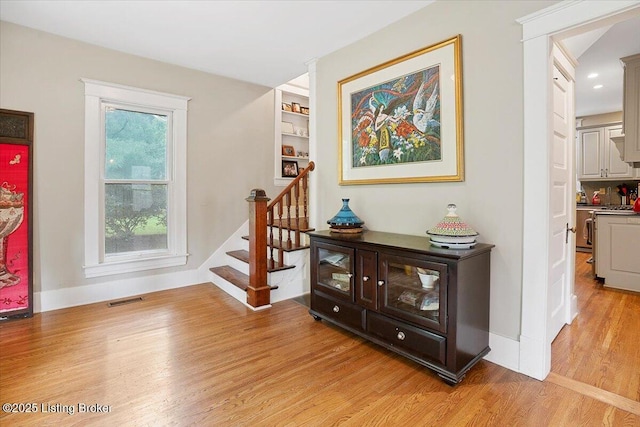 2449 Ransdell Ave, Louisville, KY 40204 - stairs with wood finished floors and baseboards