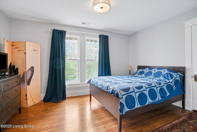 2449 Ransdell Ave, Louisville, KY 40204 - bedroom featuring wood finished floors and multiple windows