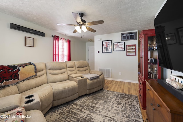 6716 Arbor Creek Dr, Louisville, KY 40228 - living room featuring wood finished floors, ceiling fan, and a textured ceiling