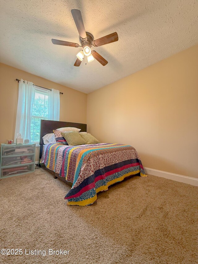 1410 Sycamore Ln, Leitchfield, KY 42754 - carpeted bedroom with a textured ceiling and a ceiling fan