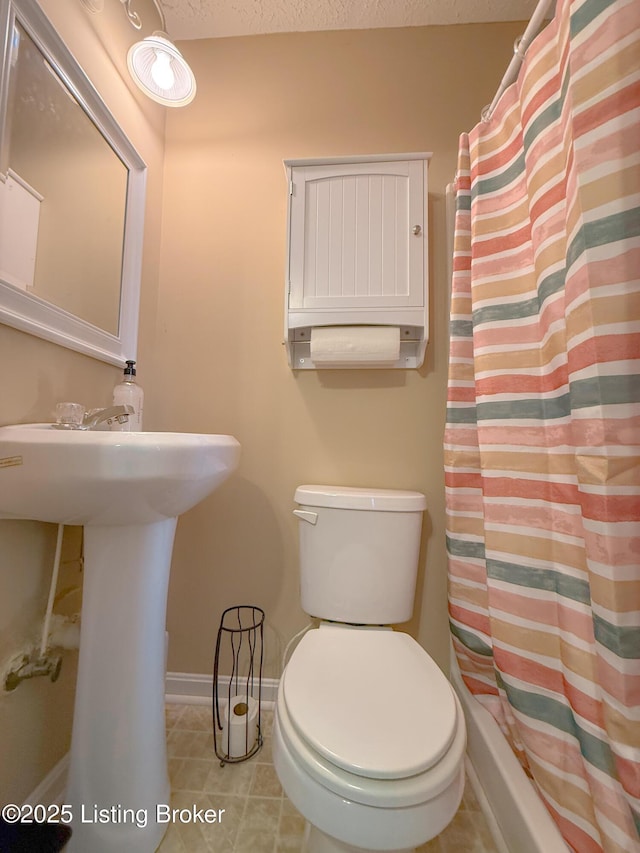 1410 Sycamore Ln, Leitchfield, KY 42754 - full bathroom featuring a shower with curtain and tile patterned flooring