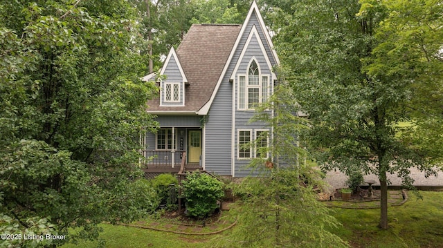 171 Cedar Point Rd, Bee Spring, KY 42207 - view of front facade featuring covered porch, a shingled roof, and a front yard