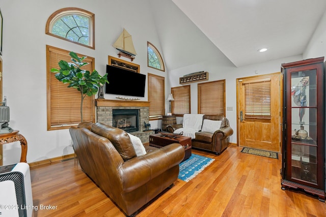 171 Cedar Point Rd, Bee Spring, KY 42207 - living area with a high ceiling, wood finished floors, a brick fireplace, and recessed lighting