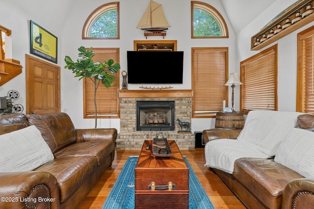 171 Cedar Point Rd, Bee Spring, KY 42207 - living room with wood finished floors, healthy amount of natural light, a brick fireplace, and high vaulted ceiling