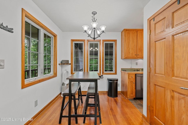 171 Cedar Point Rd, Bee Spring, KY 42207 - dining area with a chandelier and light wood-style flooring
