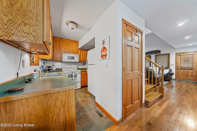 171 Cedar Point Rd, Bee Spring, KY 42207 - kitchen featuring white appliances, recessed lighting, and brown cabinetry