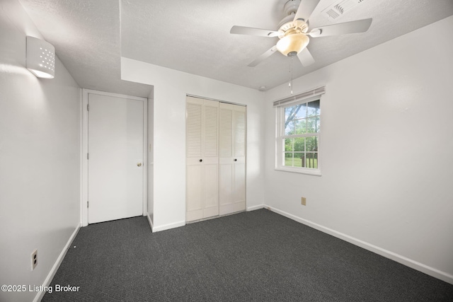547 Wyandot Ct, Radcliff, KY 40160 - unfurnished bedroom featuring dark colored carpet, a closet, ceiling fan, and a textured ceiling