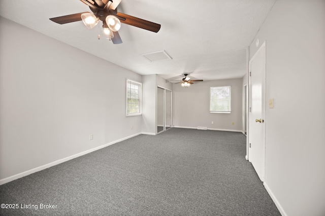 547 Wyandot Ct, Radcliff, KY 40160 - empty room with attic access, dark colored carpet, and healthy amount of natural light