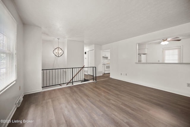 547 Wyandot Ct, Radcliff, KY 40160 - empty room with wood finished floors, a chandelier, a textured ceiling, and ceiling fan