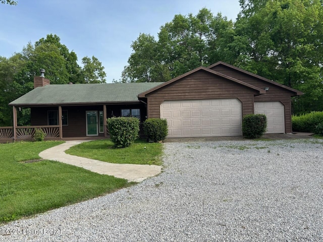 1974 N Grandview Church Rd, Cecilia, KY 42724 - single story home with a chimney, a front yard, covered porch, and a garage
