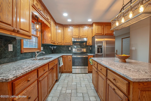 1974 N Grandview Church Rd, Cecilia, KY 42724 - kitchen featuring stainless steel appliances, light stone finish floors, brown cabinetry, under cabinet range hood, and recessed lighting