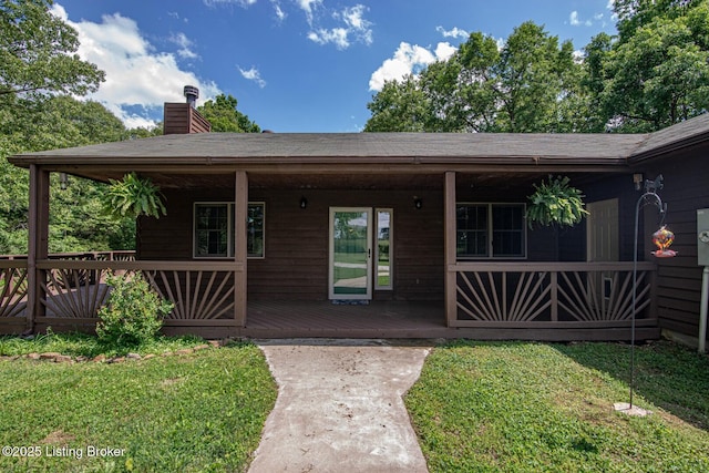 1974 N Grandview Church Rd, Cecilia, KY 42724 - view of front of home with a chimney, a front lawn, a shingled roof, and a porch