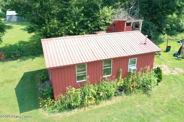 1001 Caney Fork Rd, Bardstown, KY 40004 - view of side of property with a lawn, board and batten siding, a metal roof, and an outbuilding