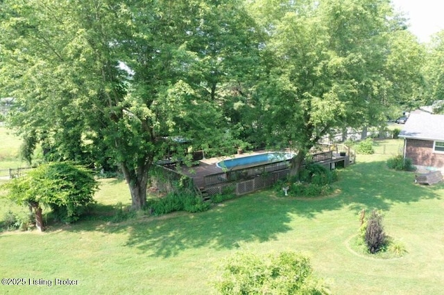 1001 Caney Fork Rd, Bardstown, KY 40004 - view of green lawn with an outdoor pool and a deck