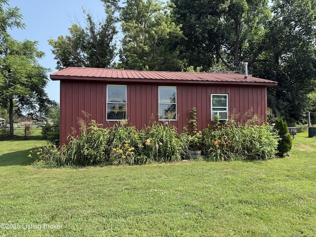 1001 Caney Fork Rd, Bardstown, KY 40004 - view of property exterior featuring board and batten siding, a lawn, and a metal roof