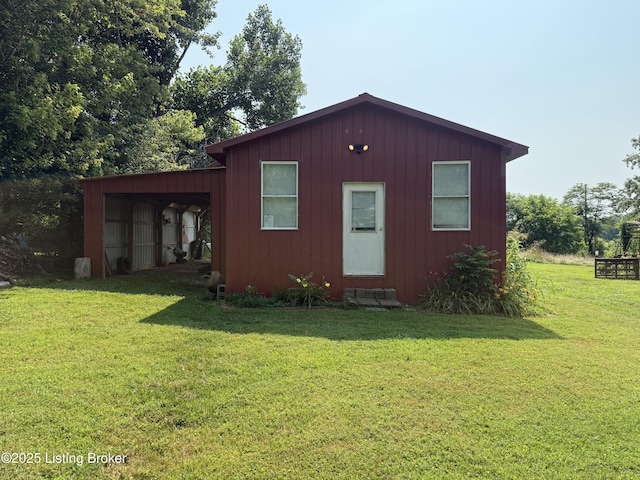1001 Caney Fork Rd, Bardstown, KY 40004 - view of home's exterior with a lawn, an outbuilding, and board and batten siding