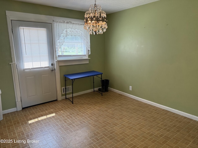 1001 Caney Fork Rd, Bardstown, KY 40004 - doorway to outside with brick patterned flooring and a chandelier