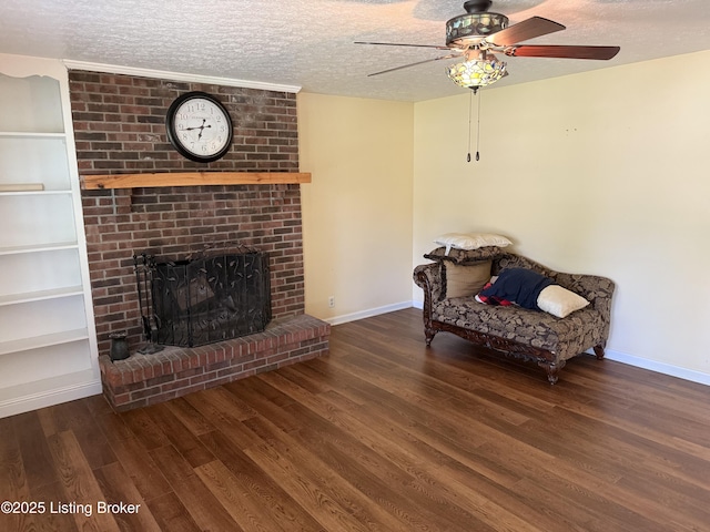 1001 Caney Fork Rd, Bardstown, KY 40004 - living area featuring a ceiling fan, wood finished floors, a textured ceiling, built in features, and a fireplace