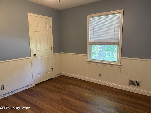 1001 Caney Fork Rd, Bardstown, KY 40004 - spare room featuring a wainscoted wall and dark wood-style floors