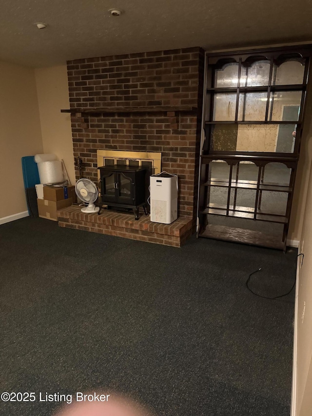 1001 Caney Fork Rd, Bardstown, KY 40004 - unfurnished living room featuring a wood stove and carpet floors