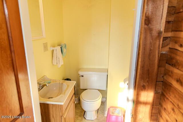 4883 S Reeves Rd, Scottsburg, IN 47170 - half bathroom featuring vanity and tile patterned floors
