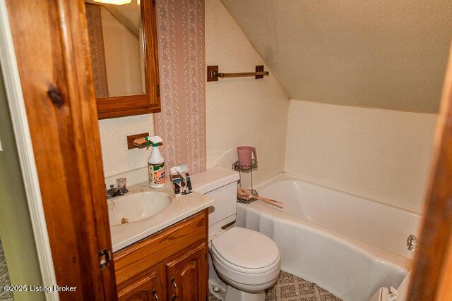 4883 S Reeves Rd, Scottsburg, IN 47170 - bathroom featuring a bath, vanity, and lofted ceiling