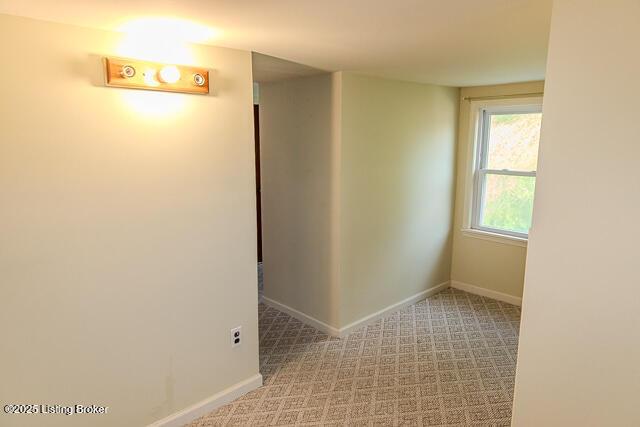 4883 S Reeves Rd, Scottsburg, IN 47170 - hallway featuring baseboards and carpet flooring