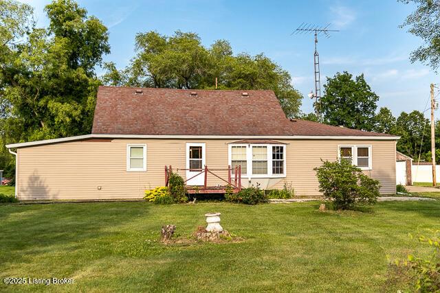 4883 S Reeves Rd, Scottsburg, IN 47170 - back of house featuring a yard