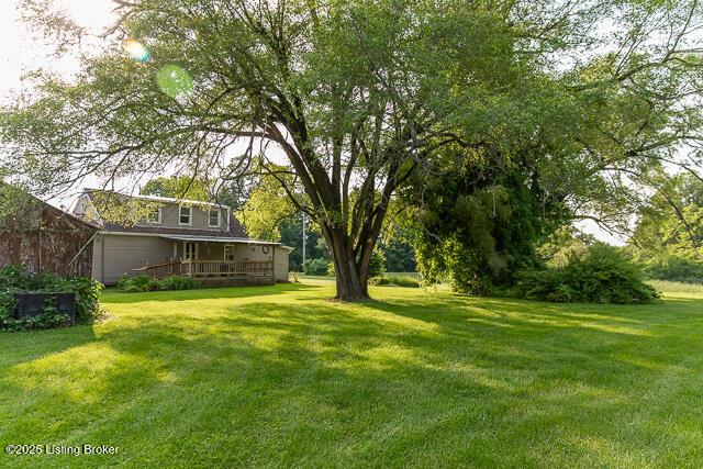 4883 S Reeves Rd, Scottsburg, IN 47170 - view of green lawn with a deck