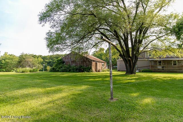 4883 S Reeves Rd, Scottsburg, IN 47170 - view of grassy yard with an outdoor structure and a barn