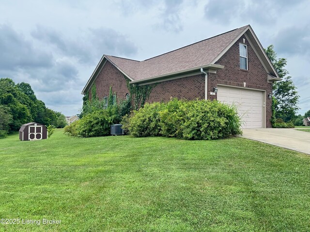 8 San Juan Ct, Elizabethtown, KY 42701 - view of side of home with brick siding, concrete driveway, an attached garage, a storage shed, and roof with shingles