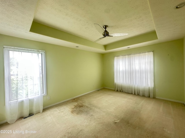 8 San Juan Ct, Elizabethtown, KY 42701 - carpeted empty room with a raised ceiling, a textured ceiling, healthy amount of natural light, and a ceiling fan