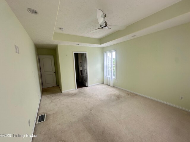 8 San Juan Ct, Elizabethtown, KY 42701 - unfurnished bedroom featuring light colored carpet, a raised ceiling, and a textured ceiling
