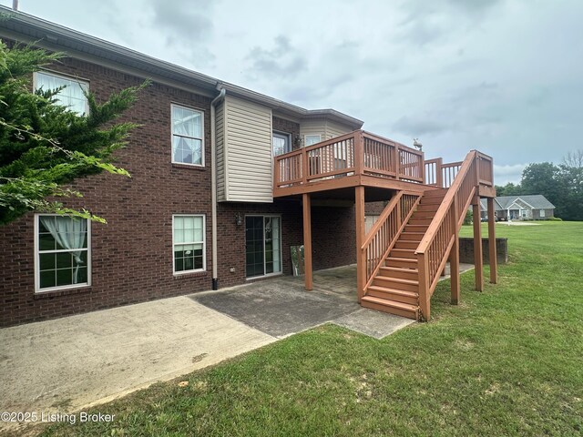 8 San Juan Ct, Elizabethtown, KY 42701 - back of property with a lawn, a patio, a wooden deck, and brick siding