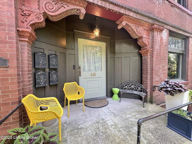 416 Belgravia Ct, Louisville, KY 40208 - doorway to property featuring brick siding