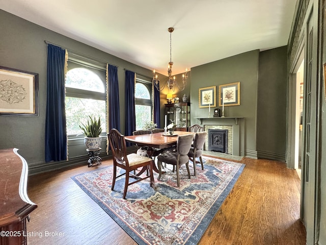 416 Belgravia Ct, Louisville, KY 40208 - dining area with a chandelier and wood finished floors