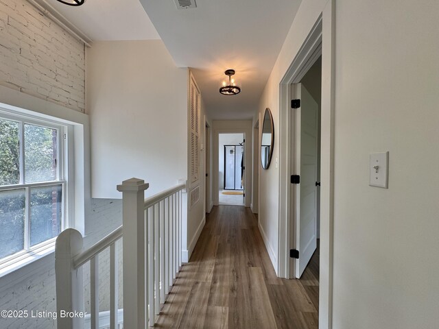 416 Belgravia Ct, Louisville, KY 40208 - hall featuring wood finished floors and an upstairs landing