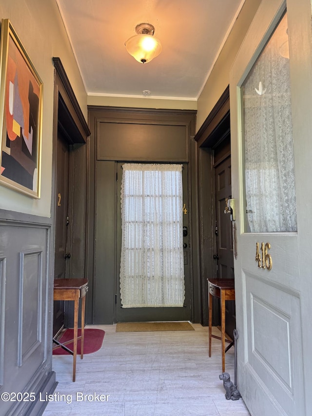 416 Belgravia Ct, Louisville, KY 40208 - entryway featuring crown molding and wood finished floors