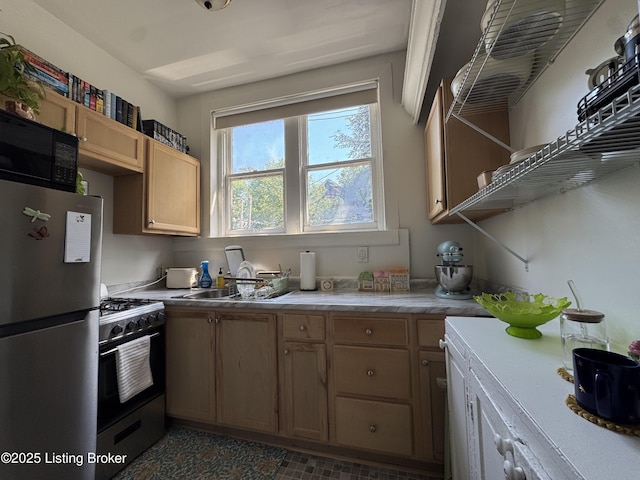 416 Belgravia Ct, Louisville, KY 40208 - kitchen with freestanding refrigerator, black microwave, range with gas stovetop, and light countertops
