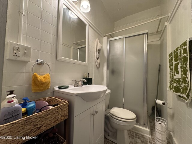 416 Belgravia Ct, Louisville, KY 40208 - full bathroom featuring tile walls, vanity, and a stall shower