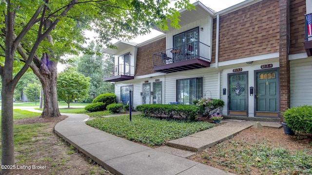 213 Fairfax Ave Apt 4, Louisville, KY 40207 - view of front facade featuring a balcony, mansard roof, and roof with shingles
