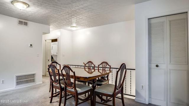 213 Fairfax Ave Apt 4, Louisville, KY 40207 - carpeted dining room featuring a textured ceiling and baseboards