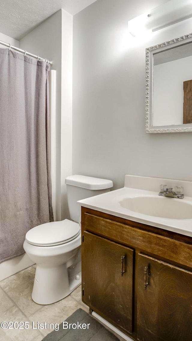 213 Fairfax Ave Apt 4, Louisville, KY 40207 - full bath with vanity, tile patterned floors, and a shower with shower curtain