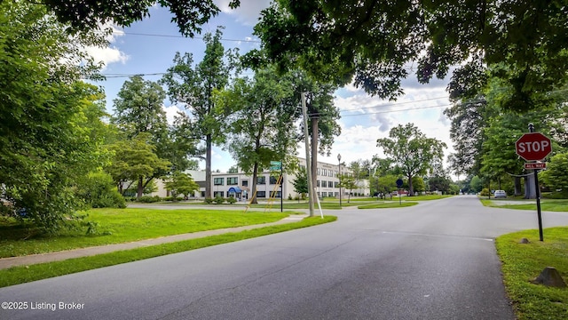 213 Fairfax Ave Apt 4, Louisville, KY 40207 - view of asphalt street featuring traffic signs and sidewalks