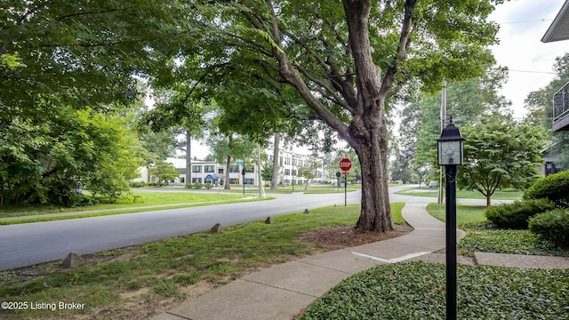 213 Fairfax Ave Apt 4, Louisville, KY 40207 - view of asphalt road featuring traffic signs and sidewalks